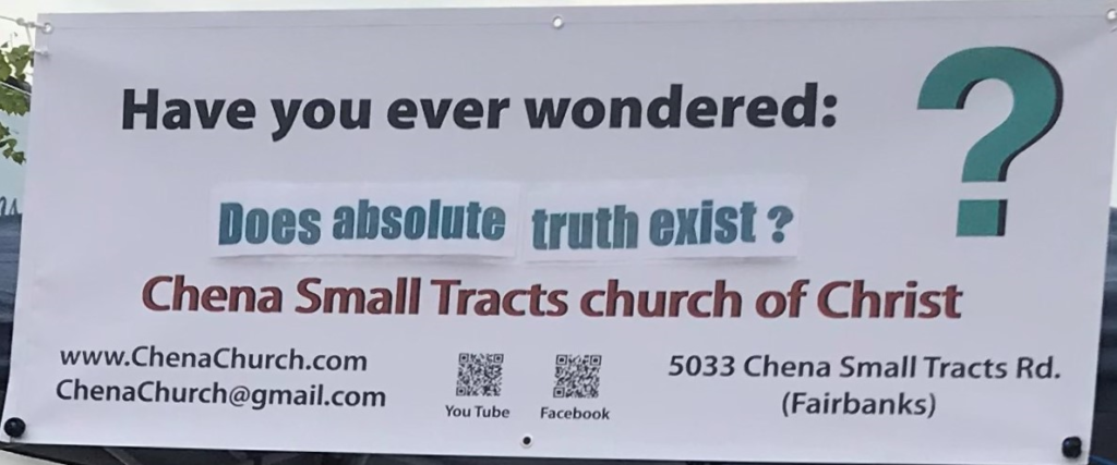 A vinyl banner asking the question "Have you ever wondered 'Does absolute truth exist?'", along with the church's website, e-mail address, QR codes for Facebook and YouTube, and physical address.